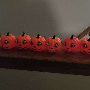 11 Rubber Squeeze Pumpkins with Bulging Eyes 2.5" x 2.5"